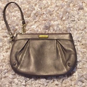 Coach Pewter W/ gold hardware wristlet.